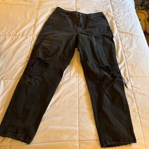 High waisted ripped black tapered jeans